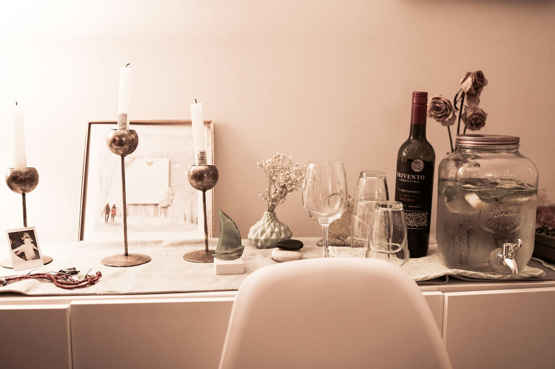 a table topped with wine glasses and a bottle of wine